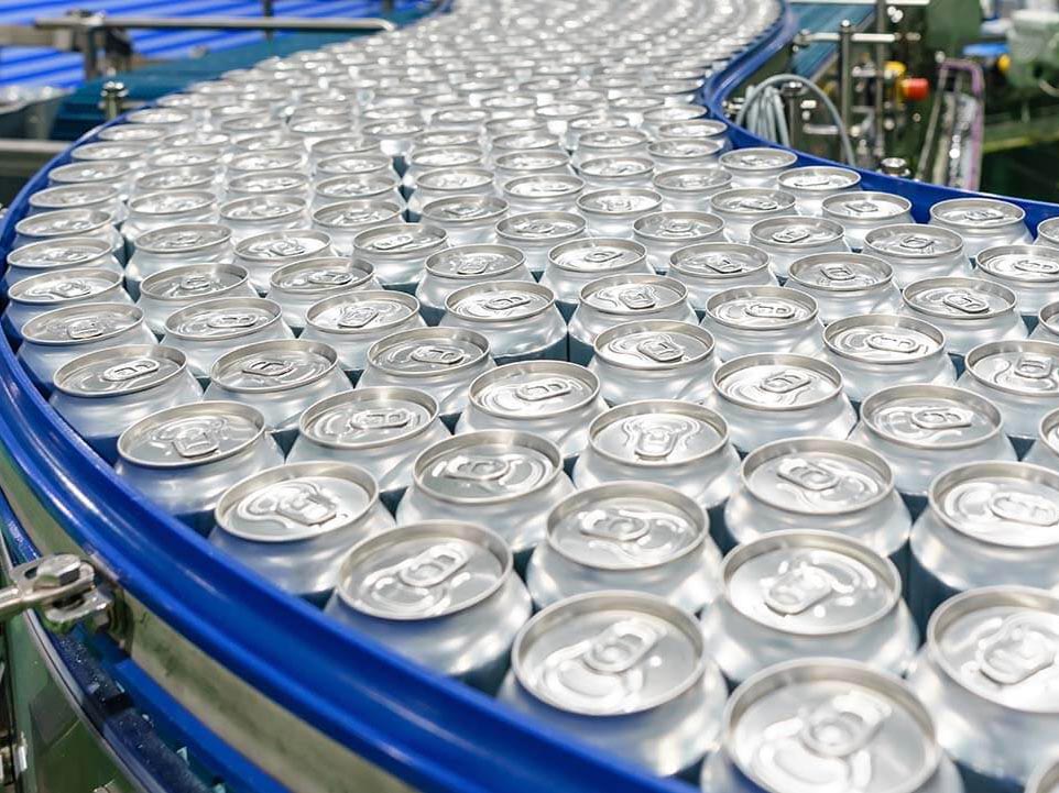sealed soda can on conveyor belt