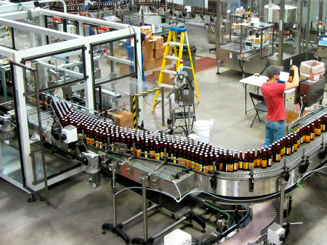 Real shot of glass bottle filling workshop