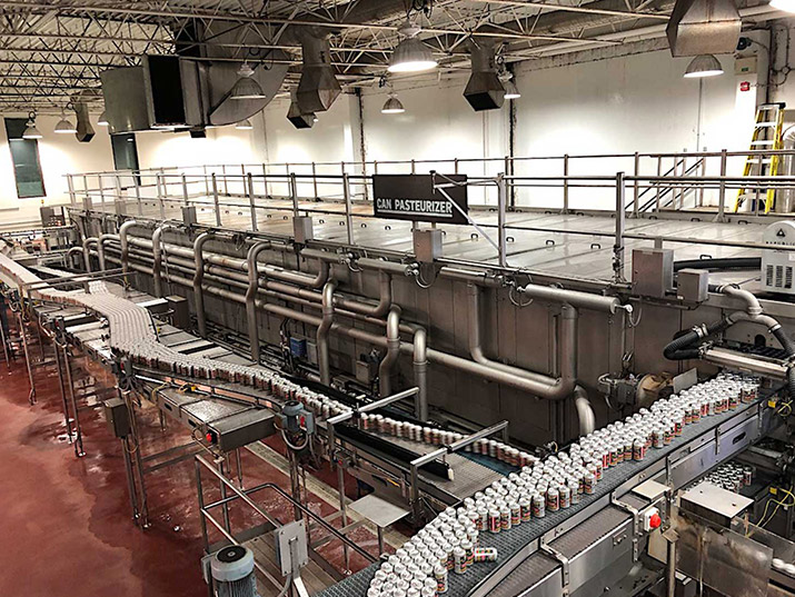 Real shot of carbonated can filling factory