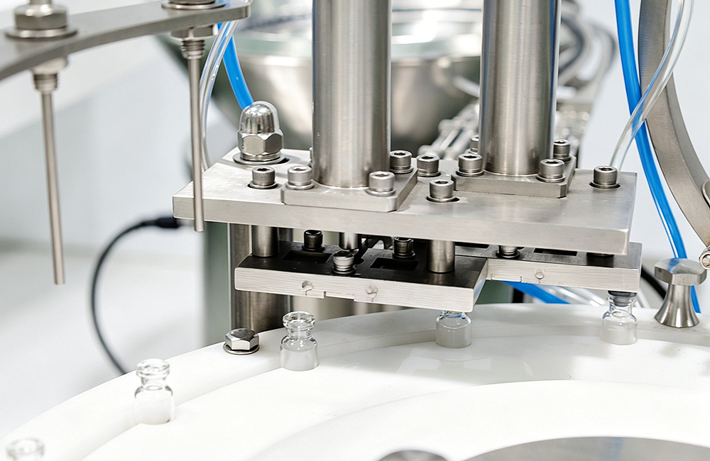 Rotary vial filling heads