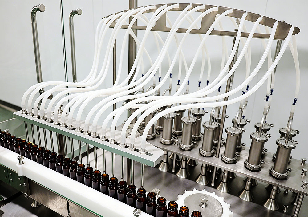 Vial filling machine nozzles