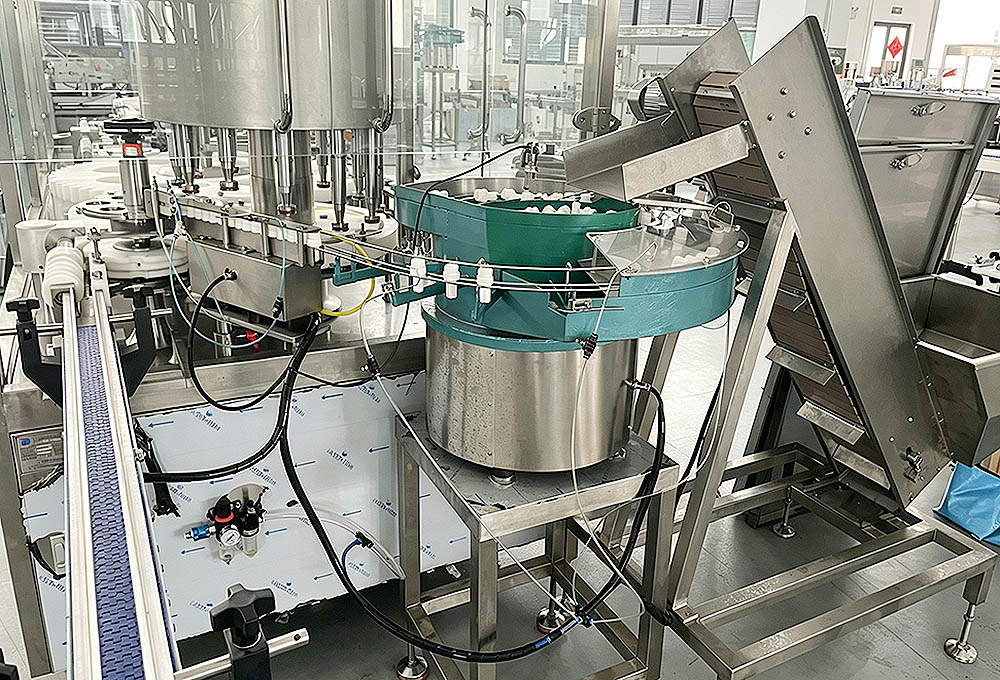 Vial capping feeding system